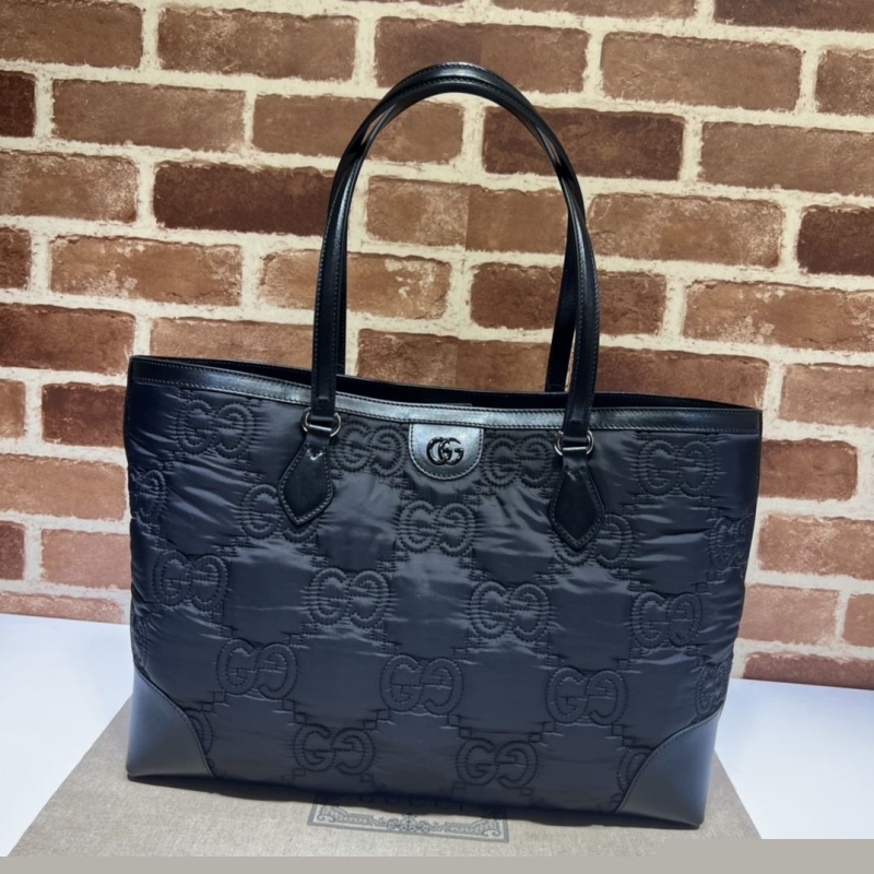 G*u*i shopping bags